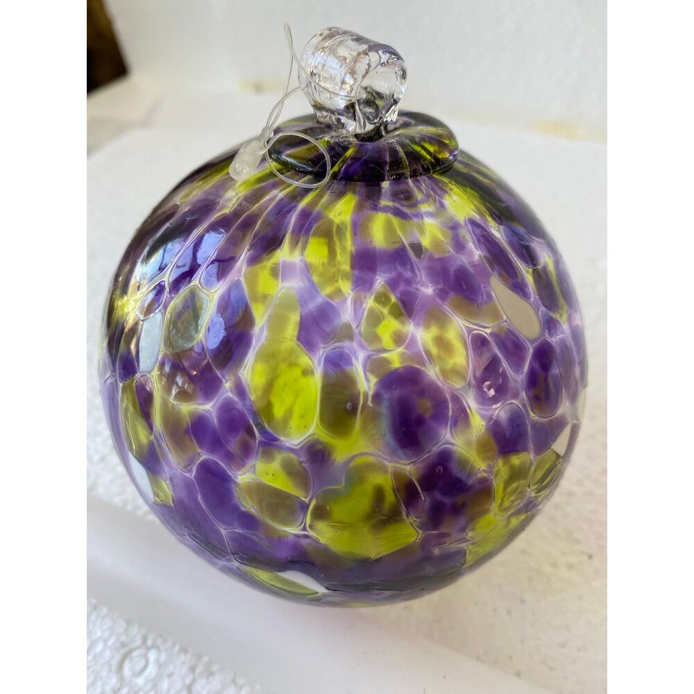 hand-blown "Calico" or "Friendship" glass ball, commonly like Kitras Art Glass.